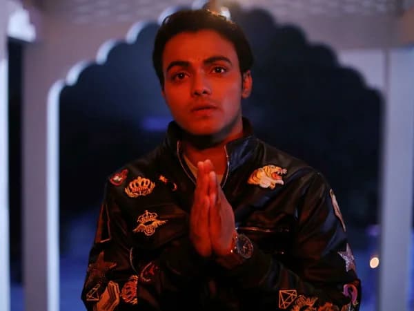Sparsh Shrivastava standing beside Bhugol in a temple set, wearing a Salman Khan jacket, with Govinda and Madhuri Dixit references visible.