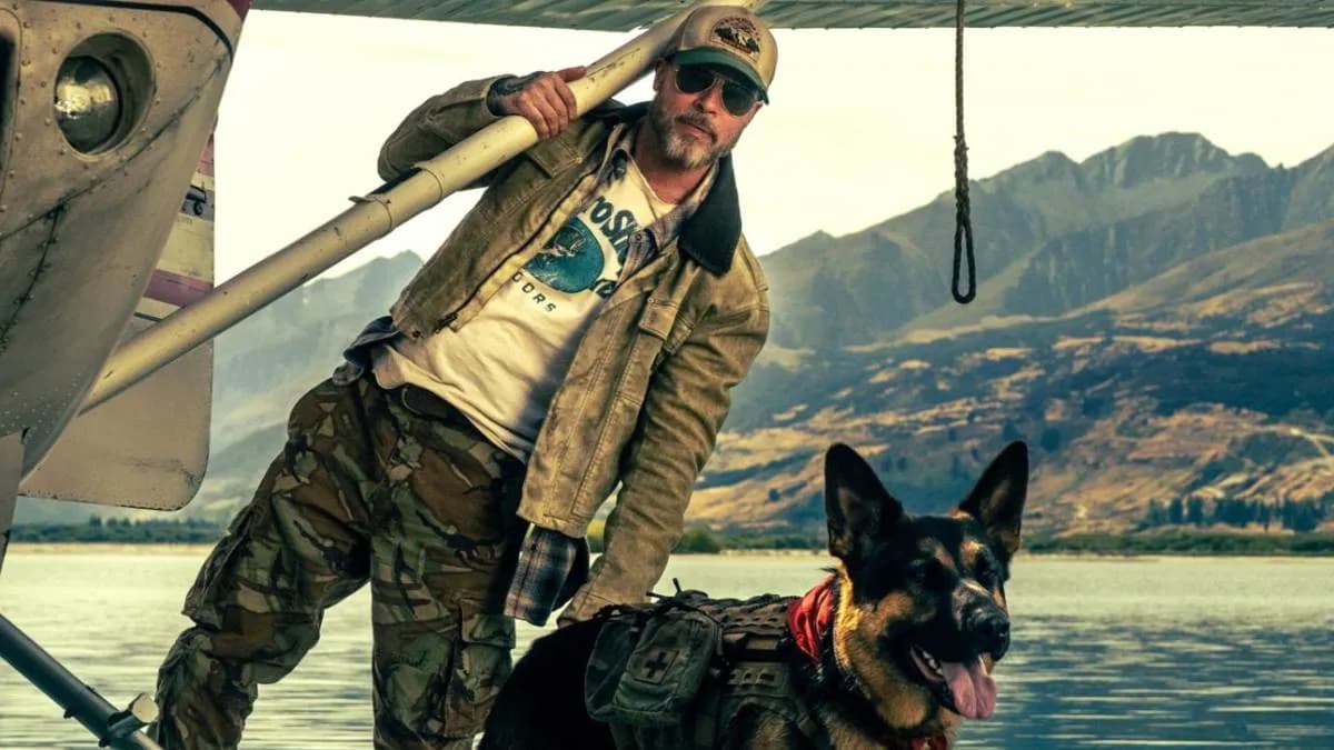 Poster of Heart of the Beast showing Brad Pitt in snow with his combat dog Odin