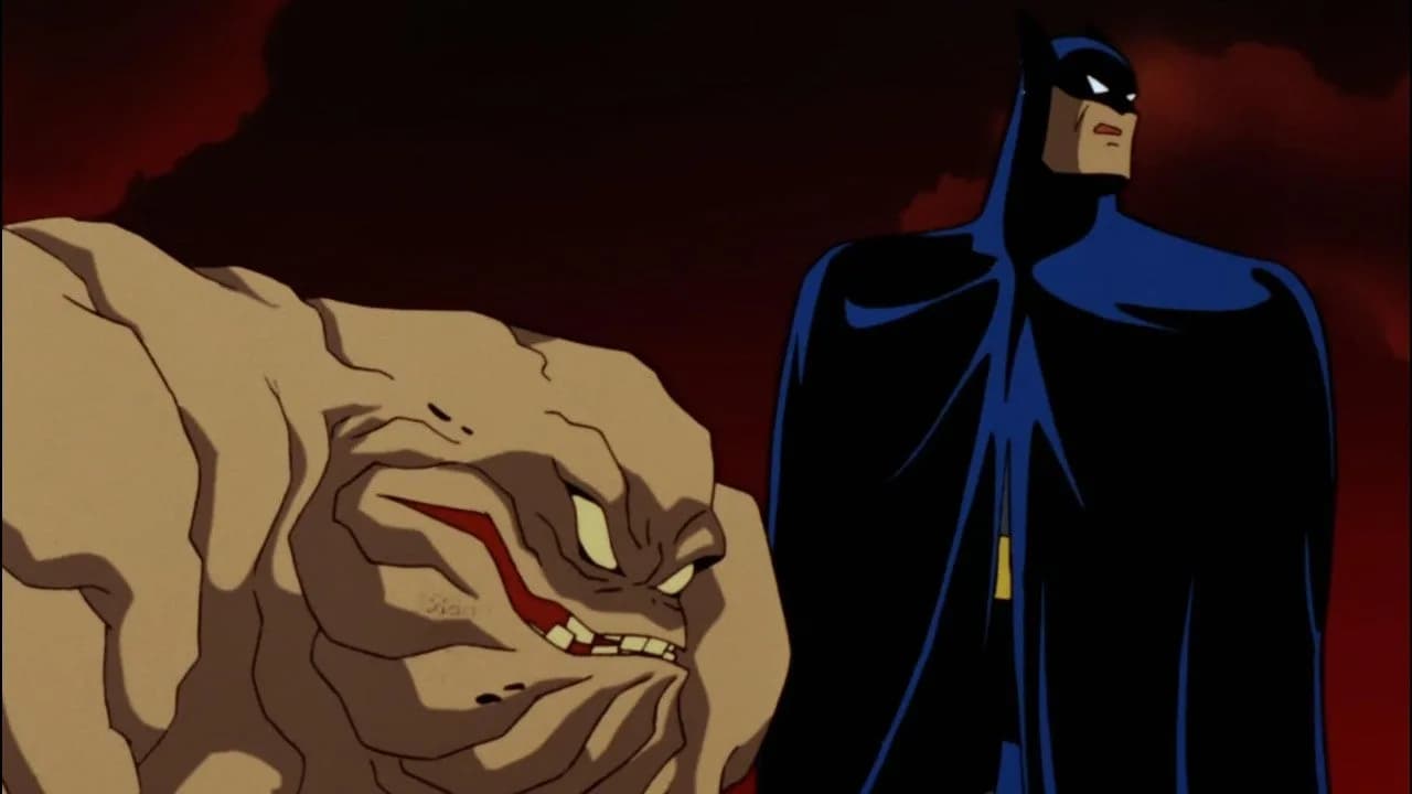 A still from Batman: The Animated Series, showing Clayface mid-transformation, face melting into a shifting mass of clay.