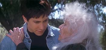 Jake Gyllenhaal as Donnie Darko standing beside Frank, the man in the rabbit suit, in a still from the film's 25th anniversary trailer
