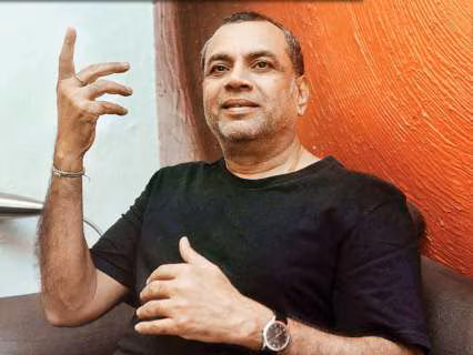 Paresh Rawal speaking to reporters, with a National Film Awards event backdrop