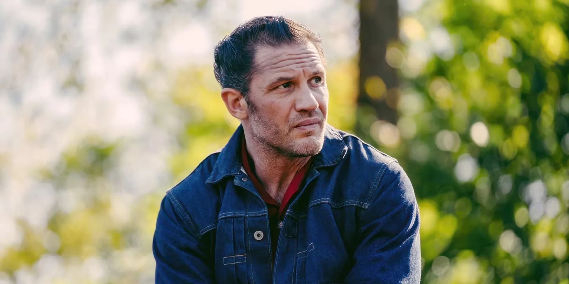 Tom Hardy in character as a motorcycle club member in a still from The Bikeriders