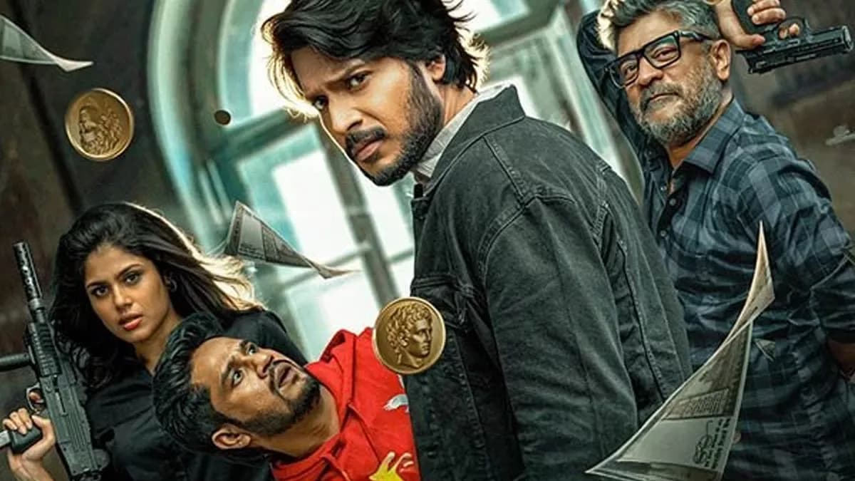 Sundeep Kishan and Faria Abdullah in Sigma, standing amidst ruins with a map in hand.