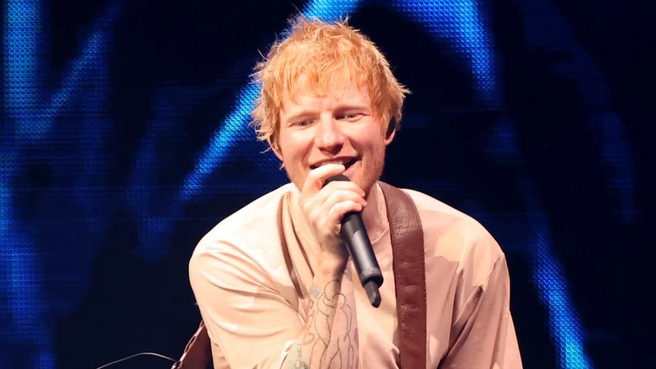 Ed Sheeran performing solo on stage with a guitar during his Loop Tour stop in Philadelphia