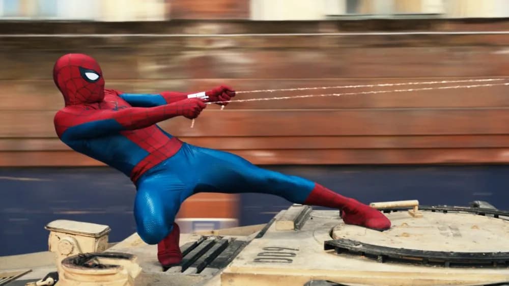 Split promotional imagery of Spider-Man in his red-and-blue suit swinging through a city and a ship at sea from The Odyssey.
