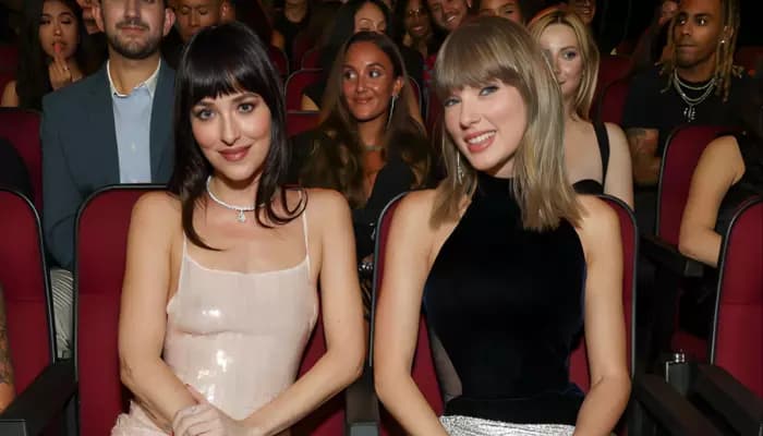 Taylor Swift and Dakota Johnson together on the set or red carpet, referencing their collaboration on the Patient Zero music video