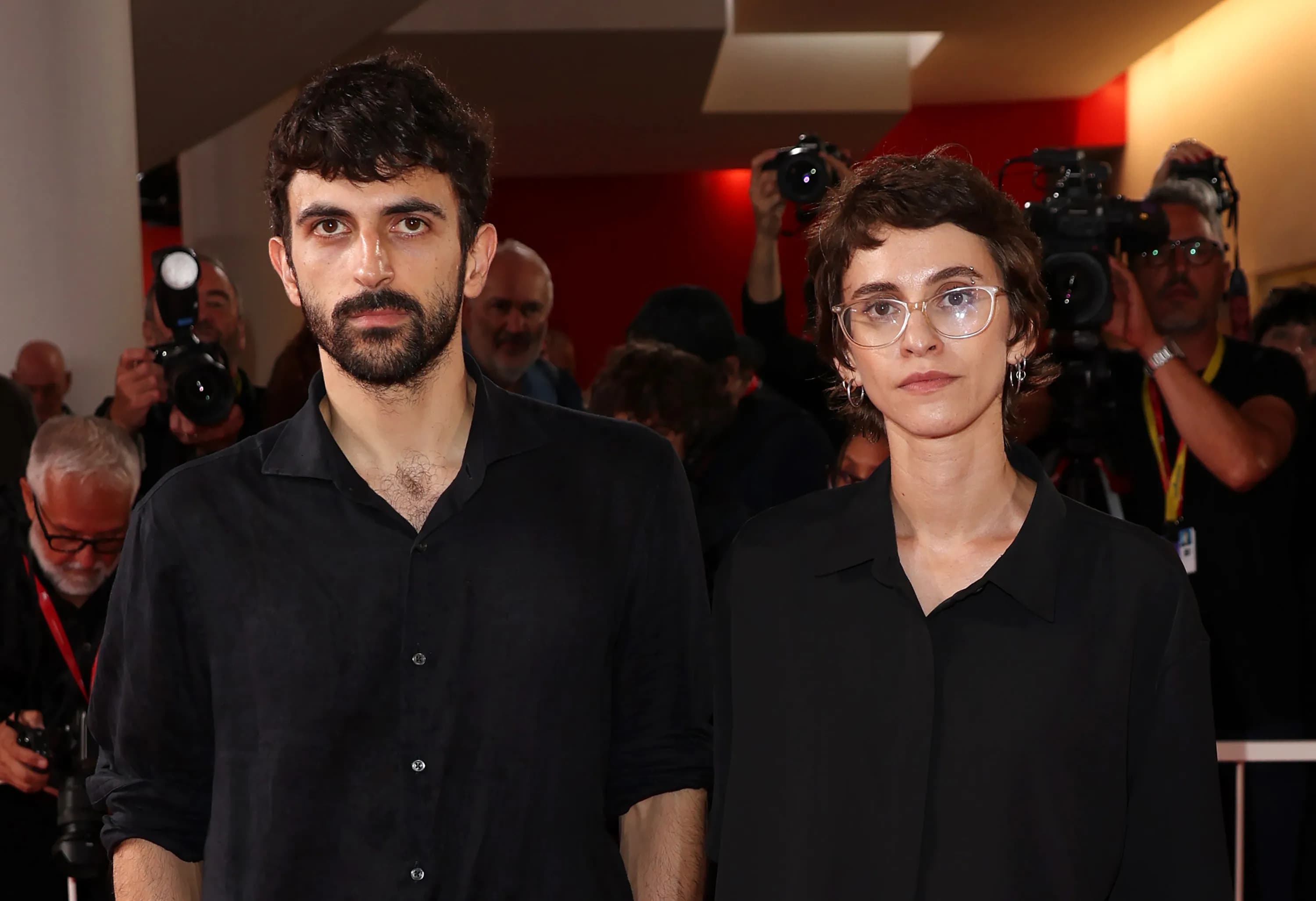 Filmmakers Yuval Abraham and Rachel Szor on stage at the Venice Film Festival accepting an award for their documentary NAZA.