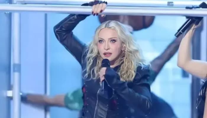 Madonna being lifted and carried onto the stage by backup dancers during a performance at the 2026 MTV Video Music Awards.