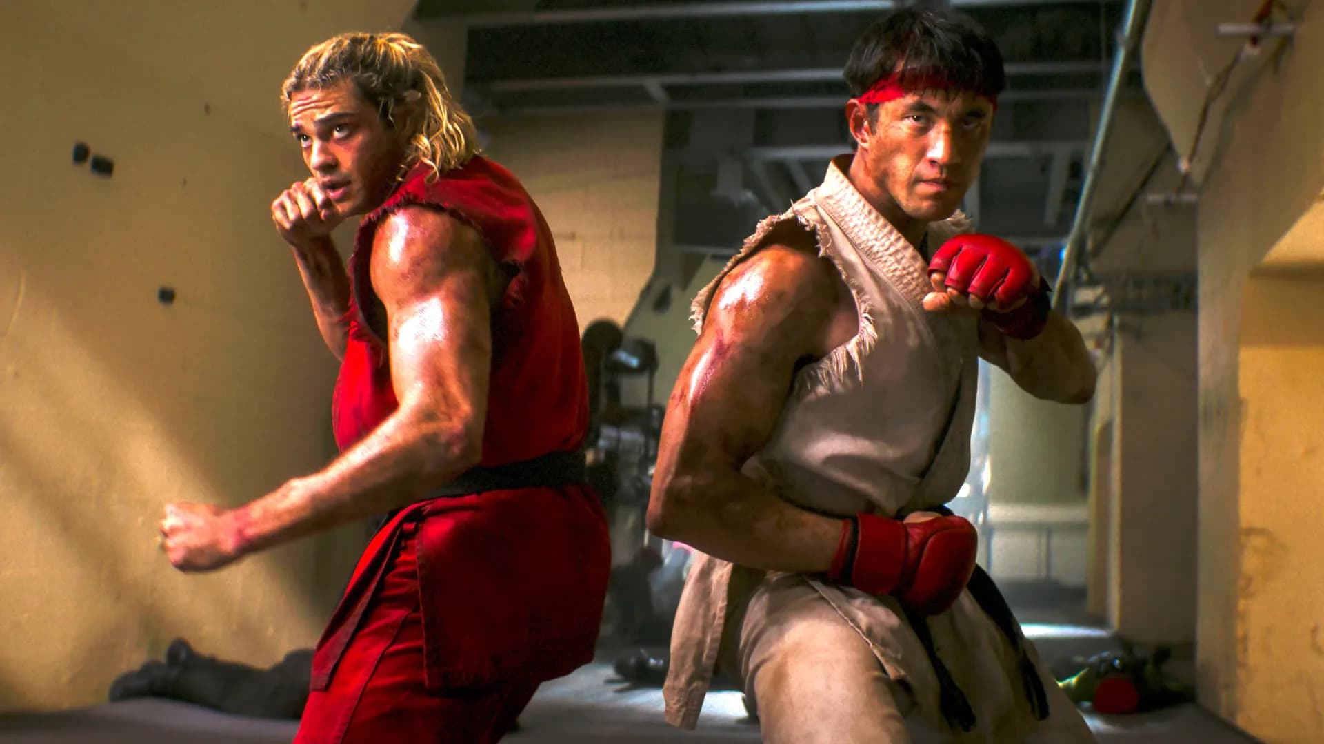 Promotional image for the 2026 Street Fighter film showing characters Ryu and Ken Masters in fighting stances ahead of the World Warrior Tournament