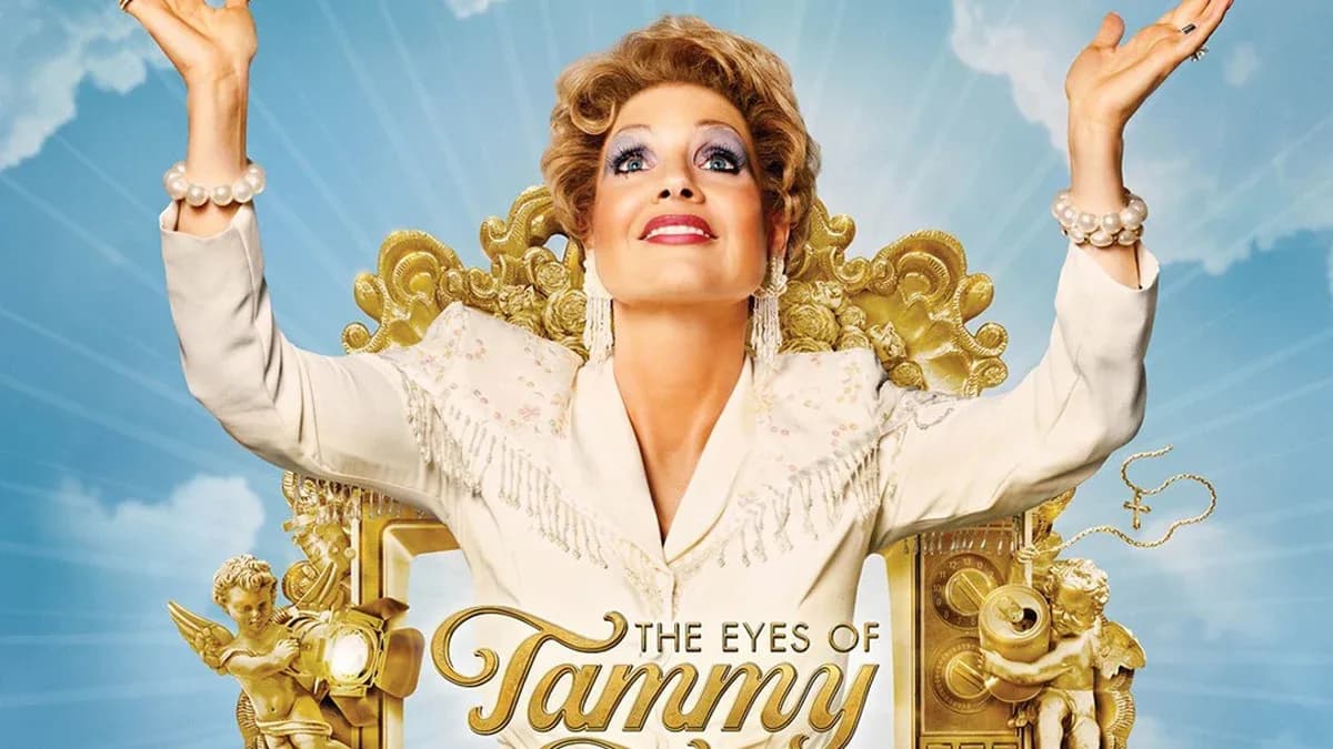 A still from The Eyes of Tammy Faye featuring Jessica Chastain as Tammy Faye Bakker, with dramatic lighting and bold eyelashes.