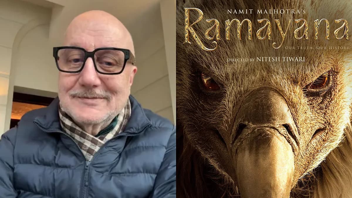 Anupam Kher in a traditional dhoti, speaking into a phone, with a backdrop of a glowing Ramayana poster featuring Jatayu the bird.