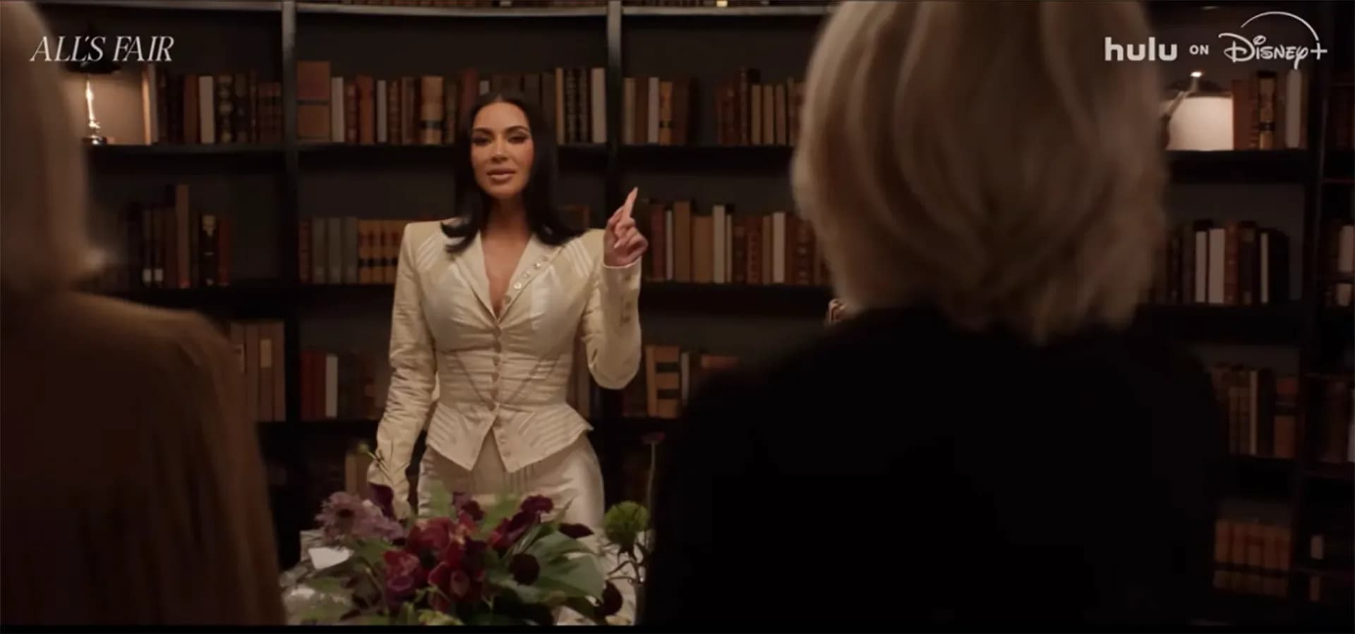 Kim Kardashian in a courtroom scene from All’s Fair, looking serious in a suit.
