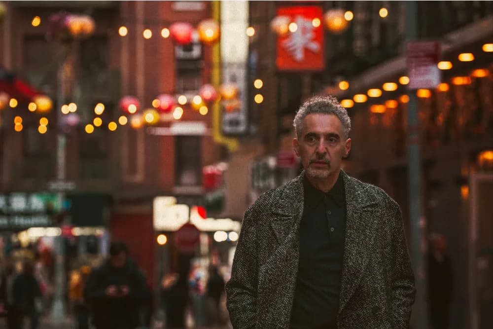 John Turturro poses for photographers, associated with his Golden Eye Award honor from the Zurich Film Festival.
