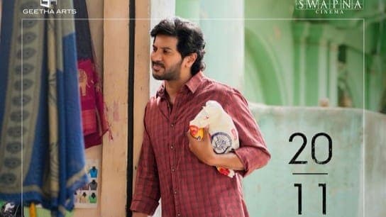 Poster art for Aakasamlo Oka Tara featuring Dulquer Salmaan and Satvika Veeravalli against a night sky backdrop