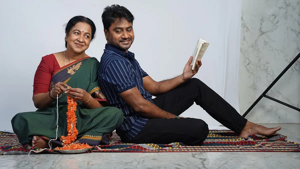 A still from Delivery Boy showing Leo Sivakumar and Radikaa Sarathkumar in a tense, intimate moment.
