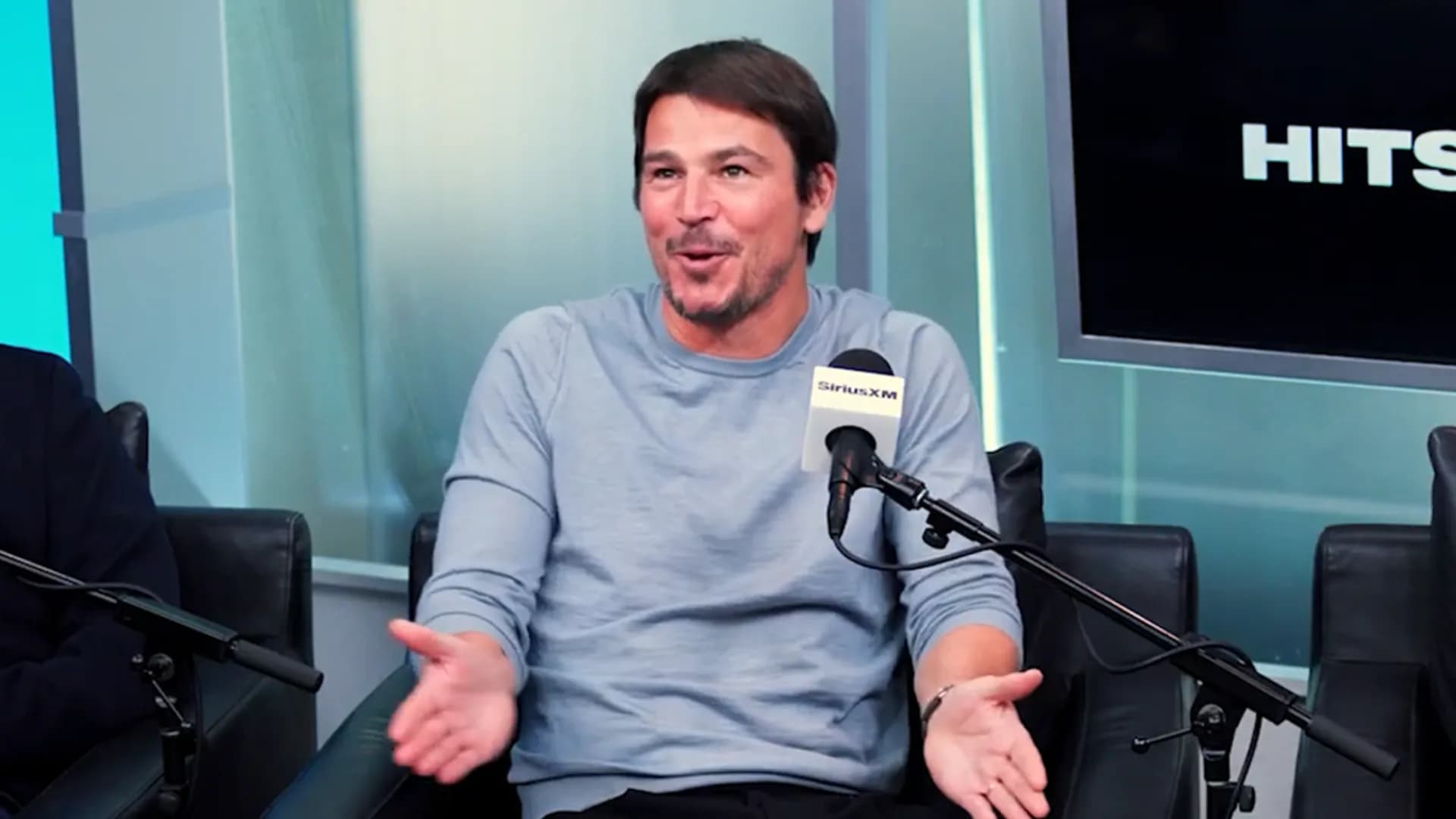 Josh Hartnett looking exhausted, leaning against a wall, mid-press tour
