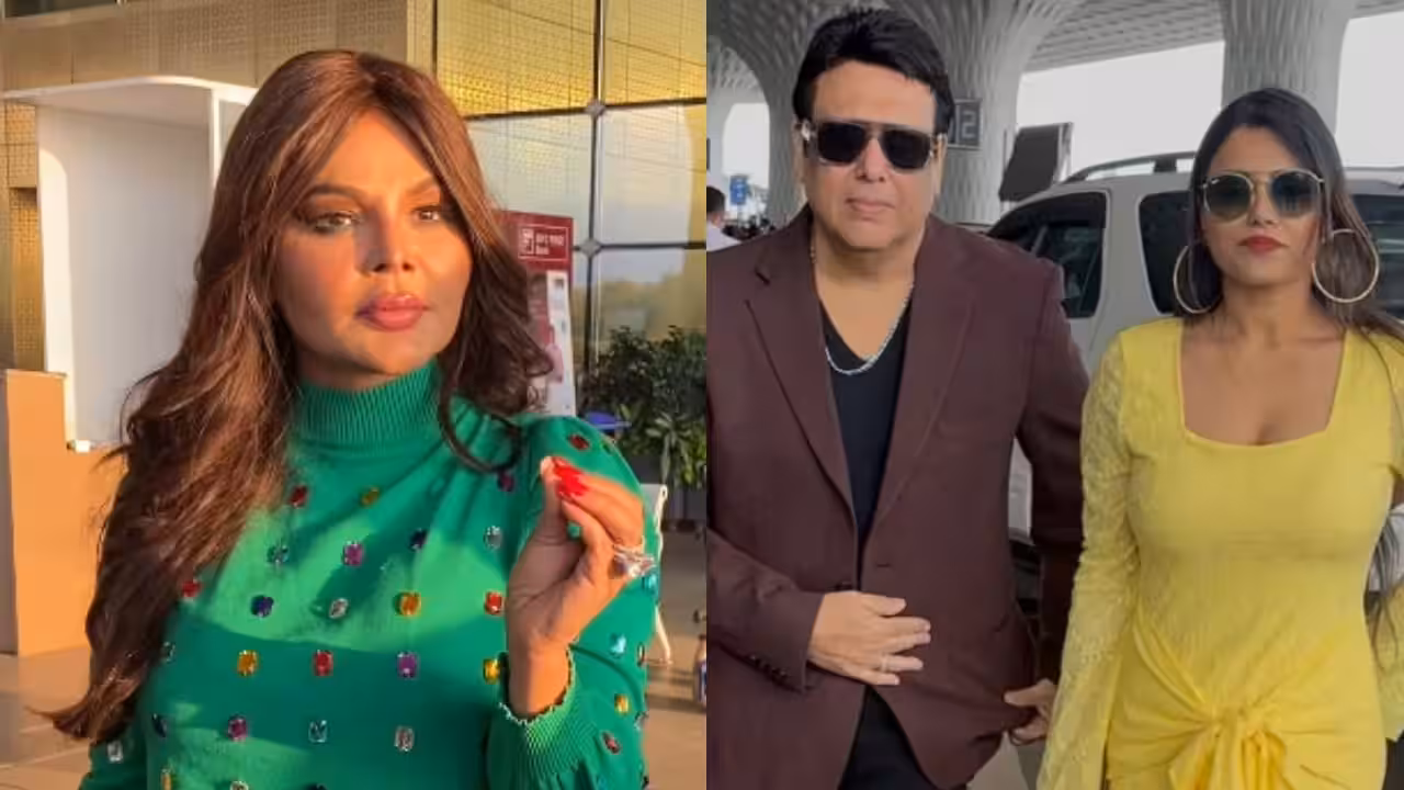 Rakhi Sawant speaking to paparazzi at Mumbai airport, gesturing sharply while addressing Komal Rani Swarnkar.