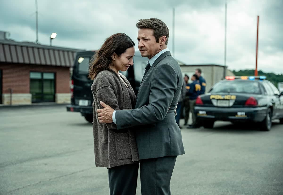 Jeremy Renner as Mike in a tense, shadowed scene from Mayor of Kingstown Season 5