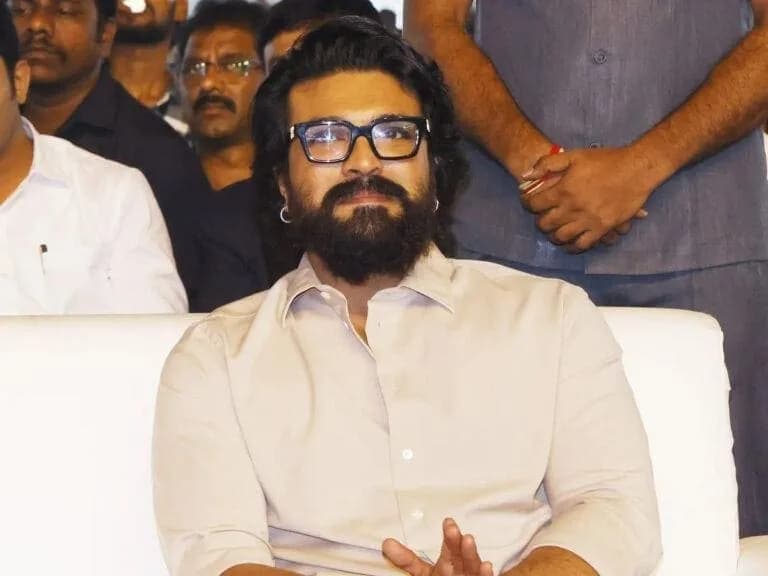 Sukumar surrounded by his team in a new office space labeled 'Den' for RC17