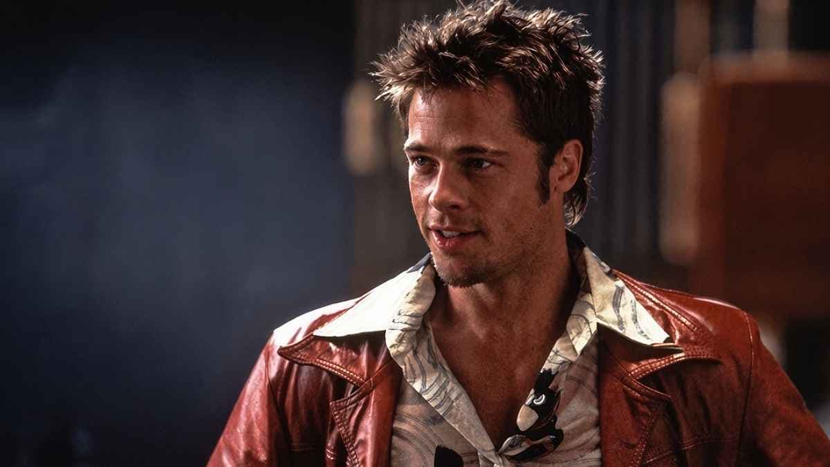A black-and-white image of Brad Pitt and Edward Norton in a dimly lit room, fists raised, from Fight Club.