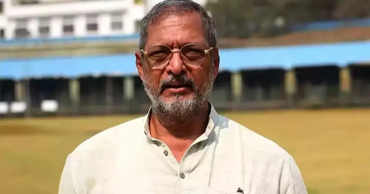 A black-and-white photo of Nana Patekar in a dramatic film pose, eyes intense, standing in front of a stormy sky.