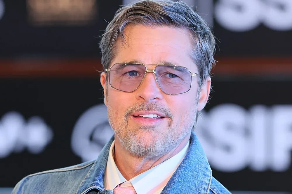Brad Pitt standing beside German Shepherd Uber at the San Sebastián Film Festival press conference