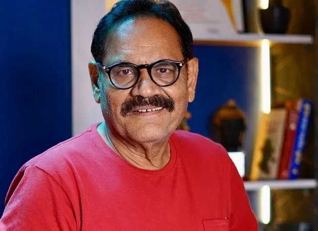Mushtaq Khan smiling on set of a 1990s Bollywood film