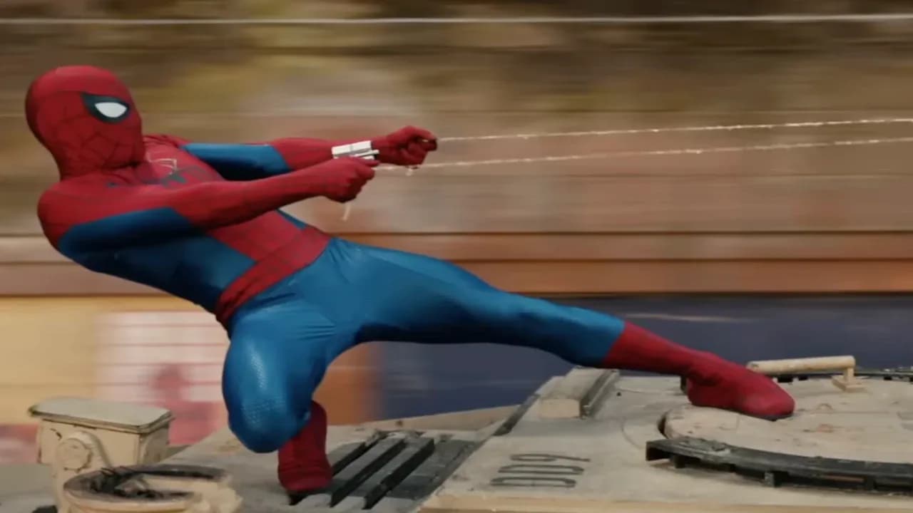Tom Holland as Spider-Man in a red-and-blue suit, mid-leap against a city skyline.