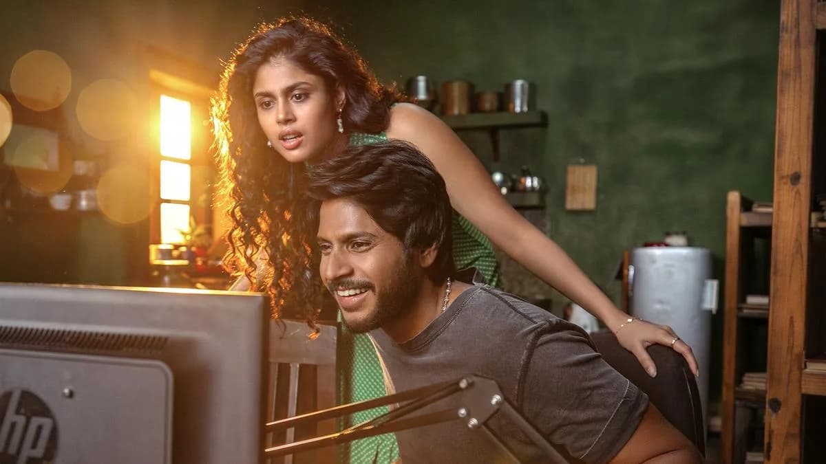 A still from Sigma showing Sundeep Kishan standing in front of a dusty library, holding a key.