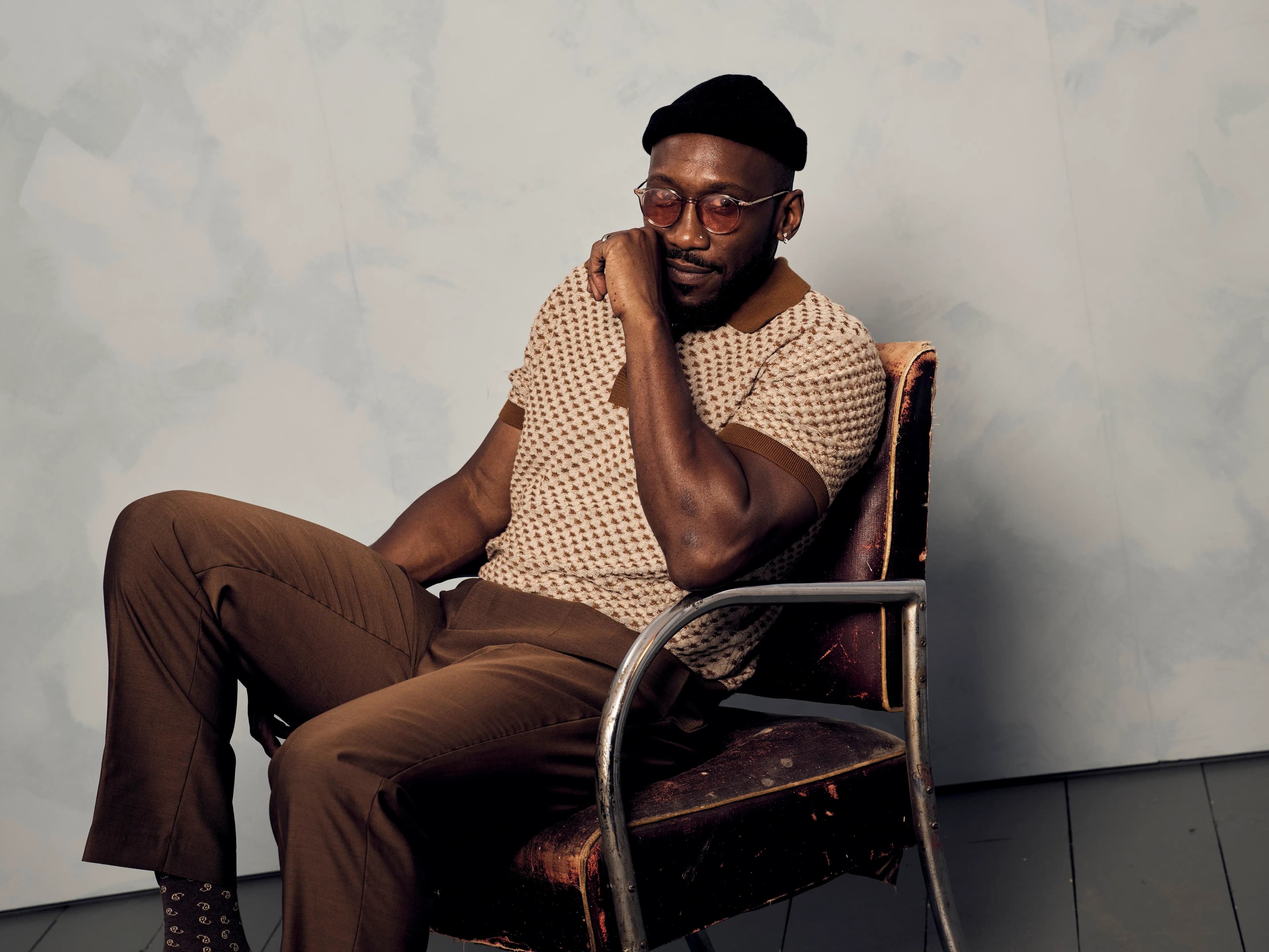 Mahershala Ali in character as Latif, holding a long blade, in a still from Your Mother Your Mother Your Mother.