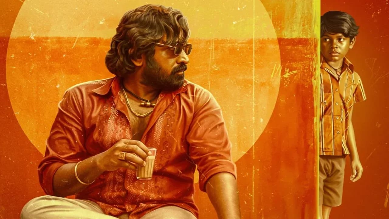 Vijay Sethupathi sitting at a kitchen table, head bowed, a plate of food in front of him. Soft light. No expression. Just stillness.