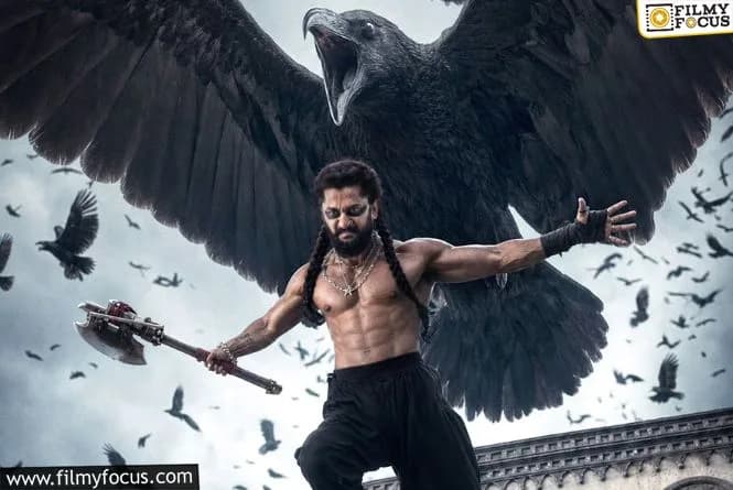 Nani in a dramatic pose from The Paradise, standing in front of a tropical landscape