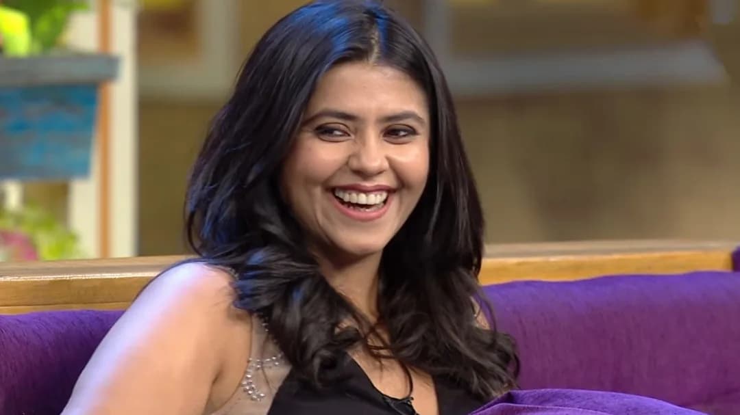 Ekta Kapoor speaking on a podcast, holding a small murti in one hand.