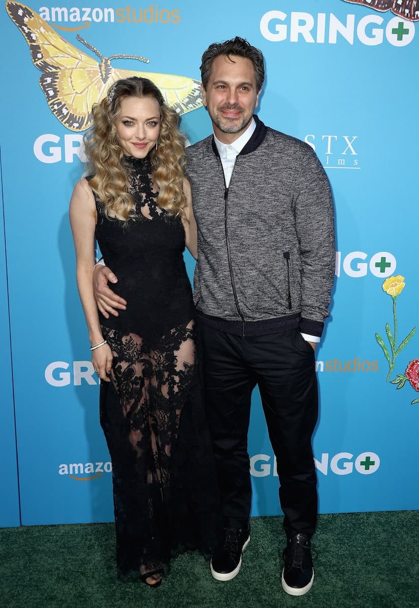 Amanda Seyfried and Thomas Sadoski posing together at a red carpet event