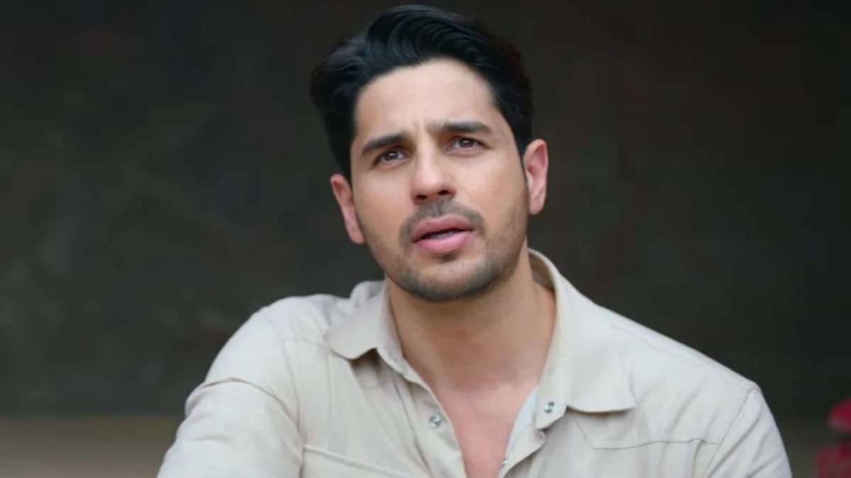 Sidharth Malhotra standing amid a misty forest set for The Vvaan, holding a sword and looking determined.