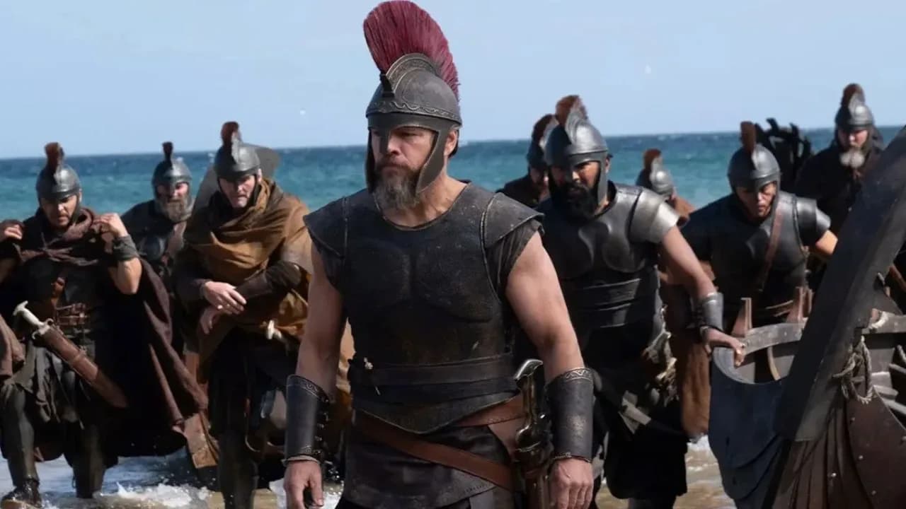 A still from 'The Odyssey' featuring Matt Damon and Anne Hathaway in a dramatic scene