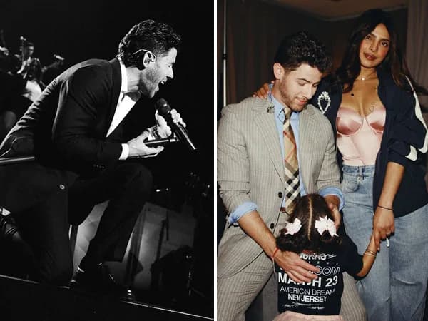 Nick Jonas and Priyanka Chopra Jonas with their daughter Malti Marie, smiling in a cozy pose with a heart emoji covering her face.