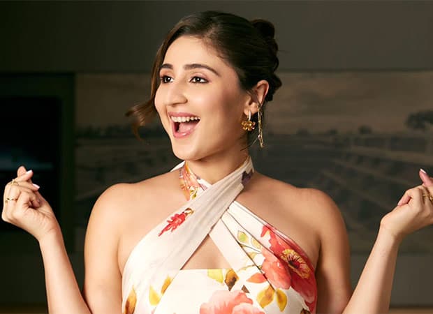 Singer Dhvani Bhanushali smiling during a public appearance