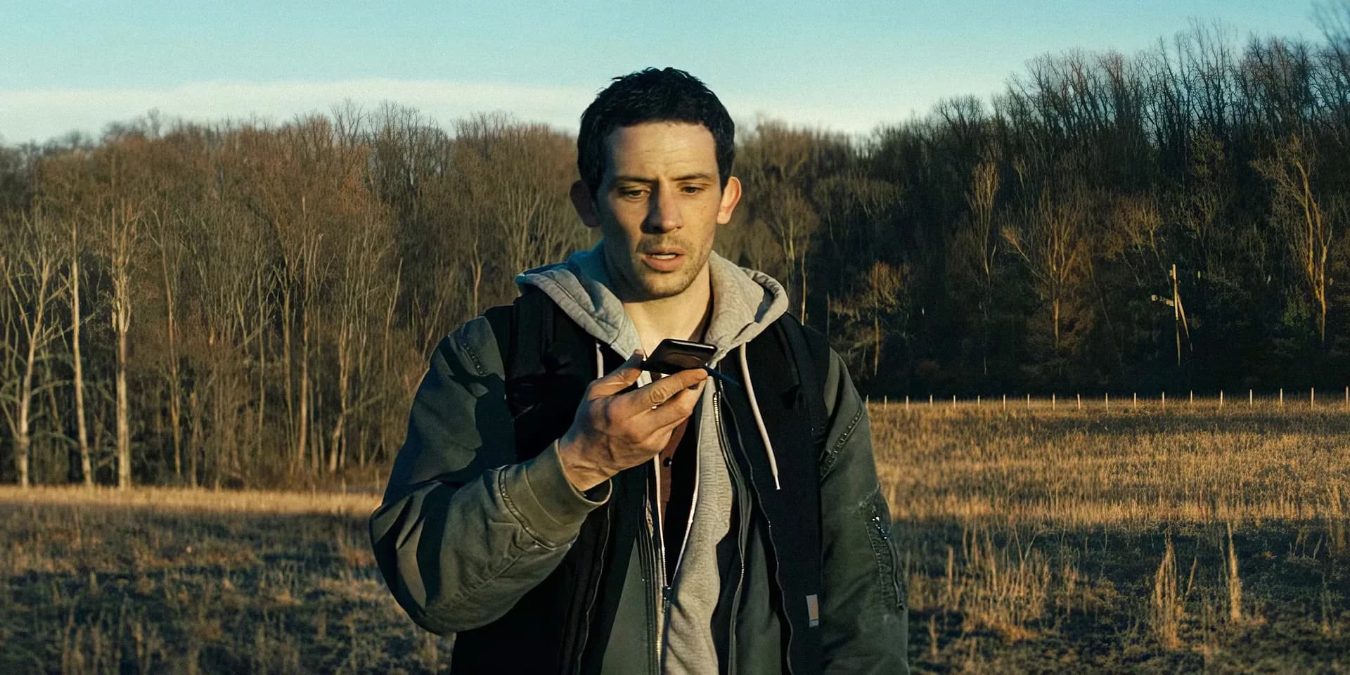 A still from Steven Spielberg’s Disclosure Day, showing Emily Blunt staring into the distance as a glowing bird hovers nearby.