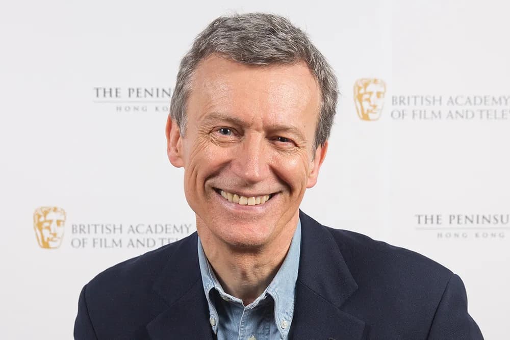 British film producer Duncan Kenworthy smiling at an industry event