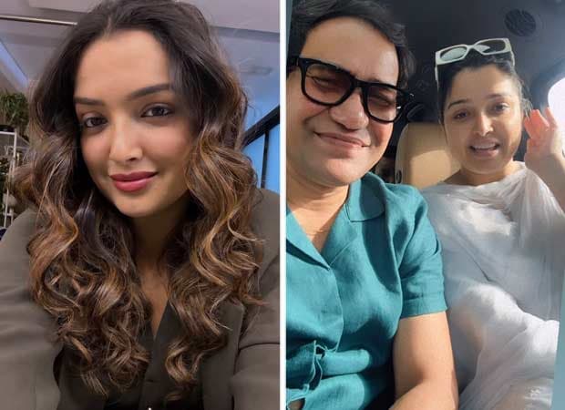 Aamrapali Dubey and Dinesh Lal Yadav (Nirahua) sitting on the Bigg Boss set, smiling