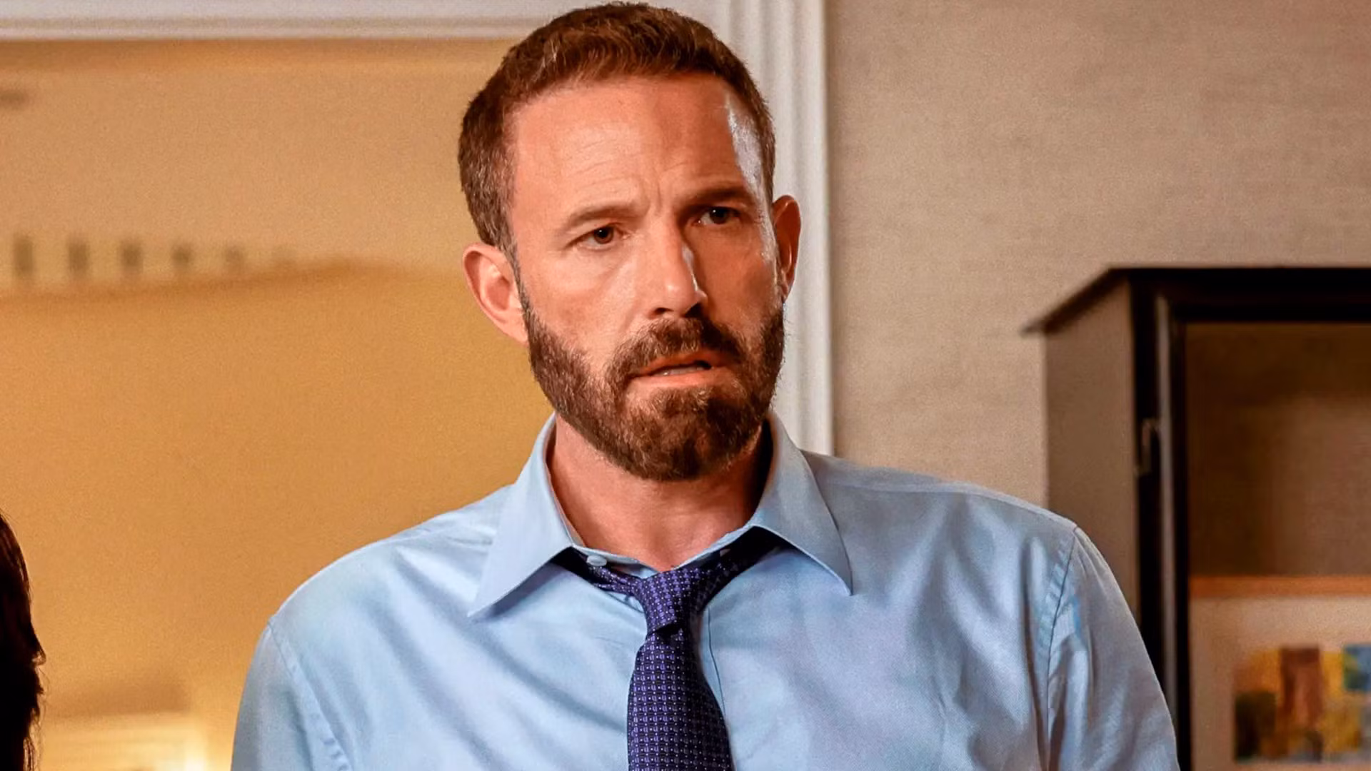 Ben Affleck in a tense scene from Animals, staring into the camera with a grim expression.