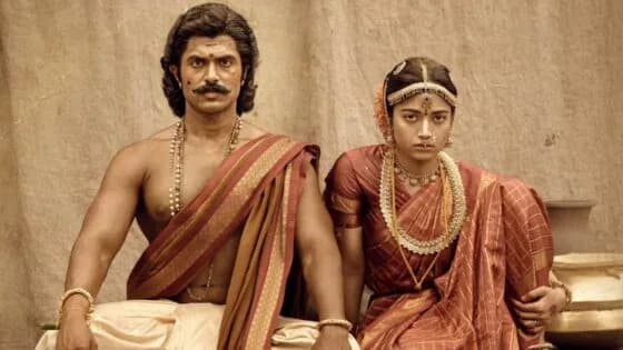 A still from Ranabaali showing Vijay Deverakonda in period attire, standing against a colonial-era backdrop.