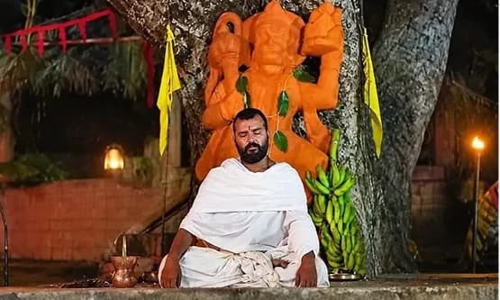 A still from Hanuman Ansh showing a serene figure in traditional attire under a glowing sky, with the title in bold Devanagari script.