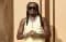Quavo cradling his newborn daughter in a white dress, captured in Erica Fontaine's Instagram post