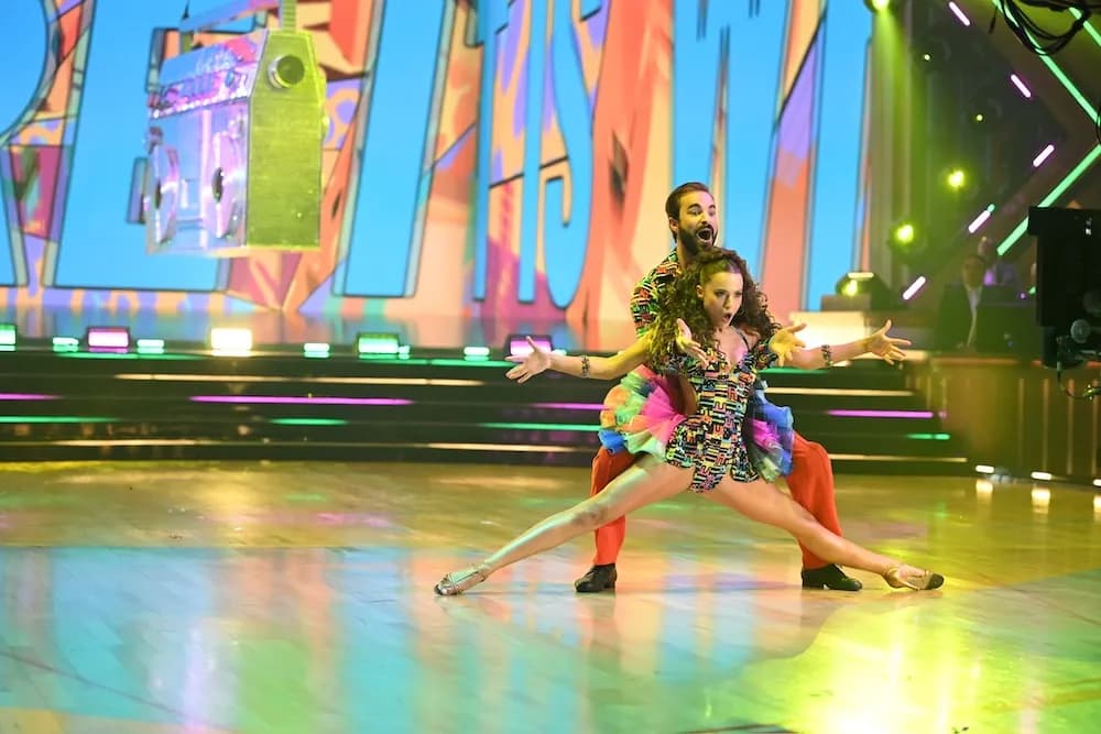 Dancing With the Stars season 35 hosts Julianne Hough and Alfonso Ribeiro on stage during the premiere episode