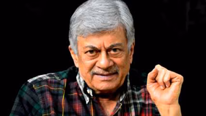 Veteran actor Anant Nag smiling in a formal portrait, associated with his Dadasaheb Phalke Award announcement