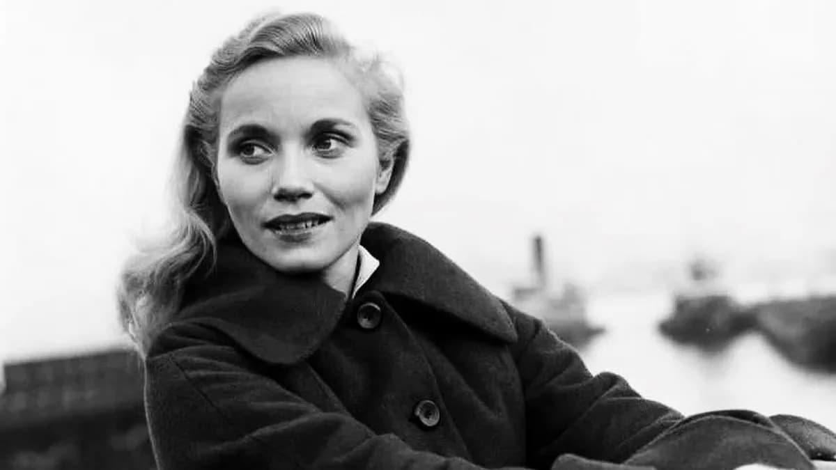Eva Marie Saint in a black dress, looking directly at the camera, her expression composed and intense.