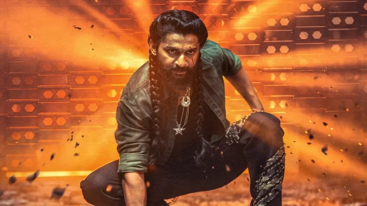A still from The Paradise featuring Nani in a dramatic pose against a golden sky.