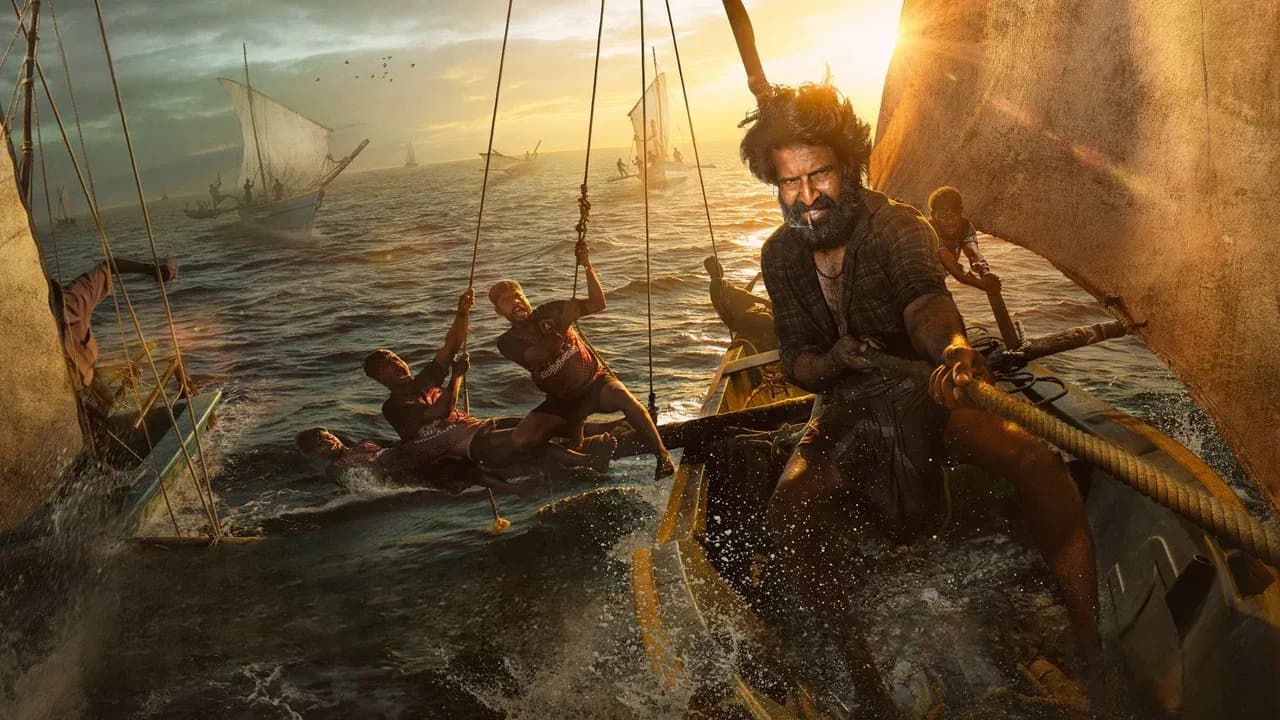 Soori and Suhas in a tense moment from Mandaadi, standing on a sailboat deck under stormy skies